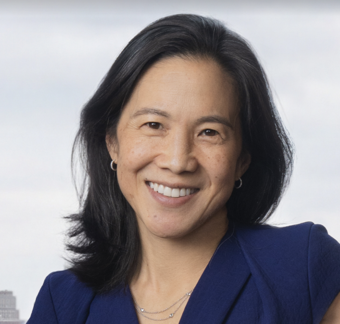 Headshot of Angela Duckworth wearing a blue v-neck blouse.